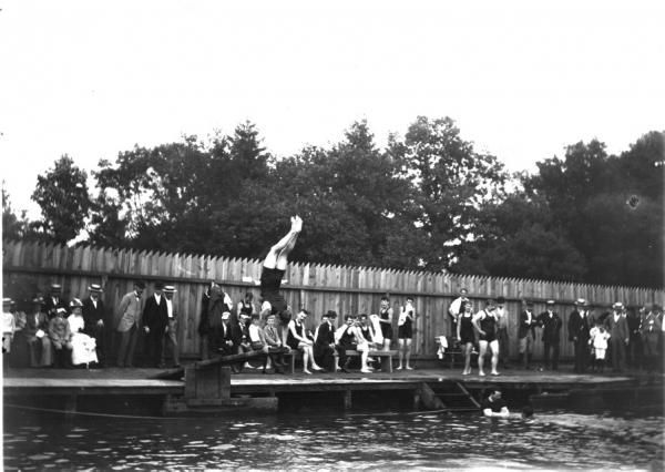 Man doing a handstand on a diving board, Wayne Natatorium, Wayne, PA, 1897